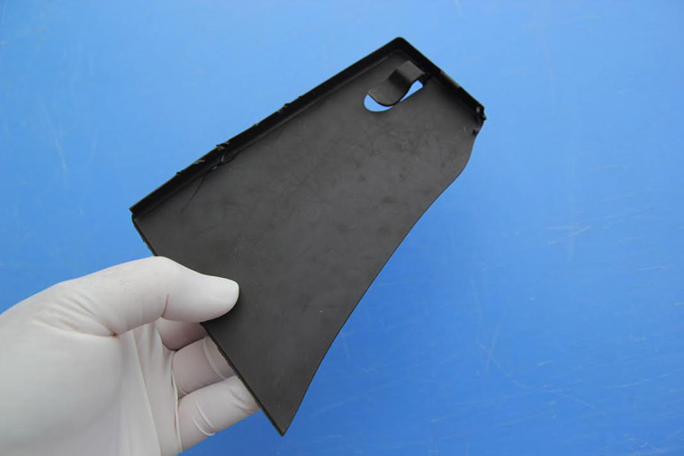 This sharp piece of plastic was found in a stomach chamber during a necropsy of the 45-foot long female sei whale that died in the Elizabeth River last week. (Courtesy of the Virginia Aquarium and Marine Science Center)