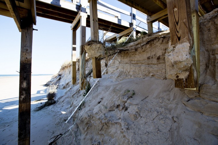 The pillars on a boardwalk at the Cape Henry beach in Virginia Beach are exposed Monday, Nov. 3, 2014, after recent storms that washed away about 15 feet of dune. (Thé N. Pham | The Virginian-Pilot)