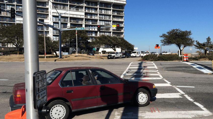 Note crosswalk signal across Shore Drive. This vehicle has right of way over pedestrian crossing.